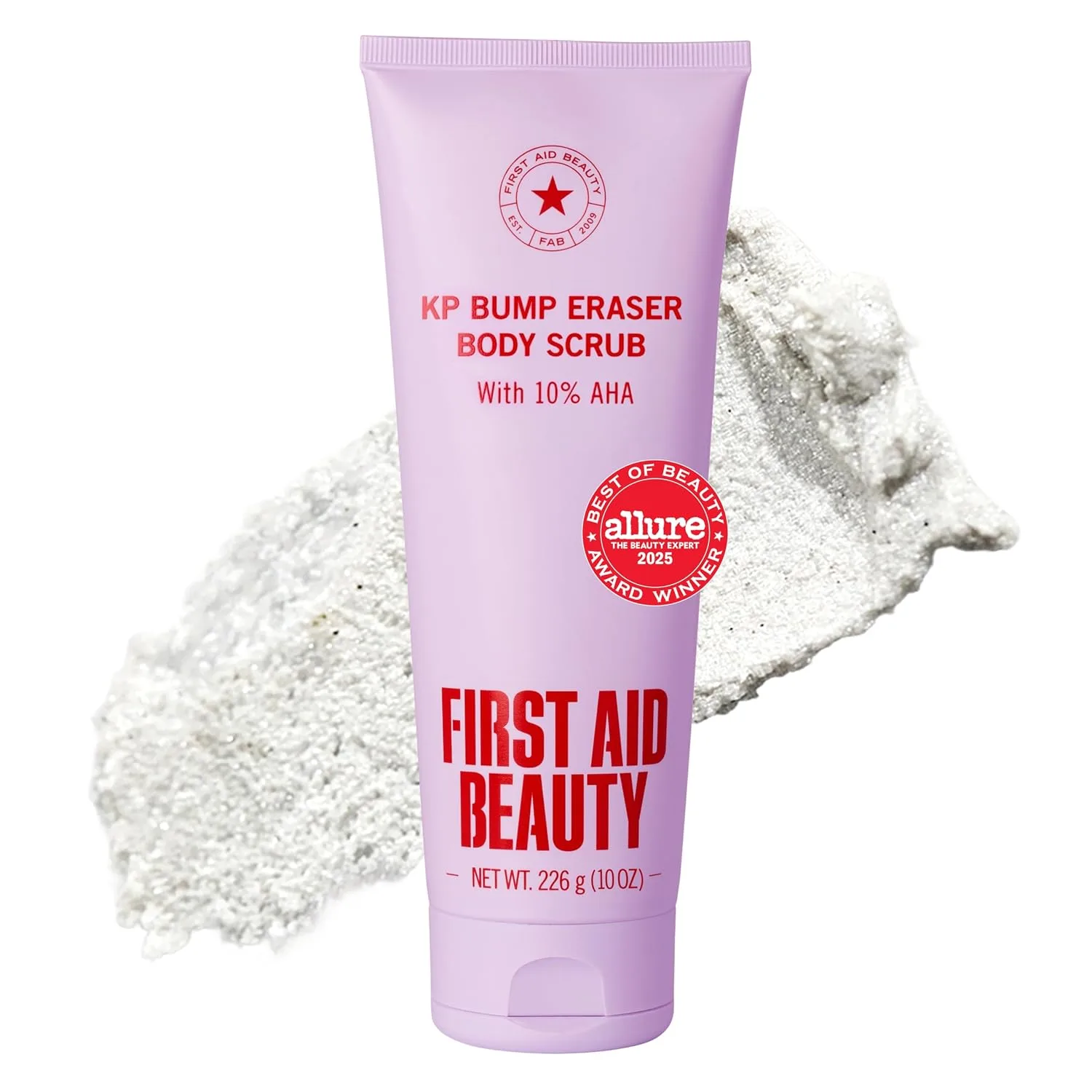 First Aid Beauty KP Bump Eraser body scrub tube shown with gritty exfoliating texture swatch