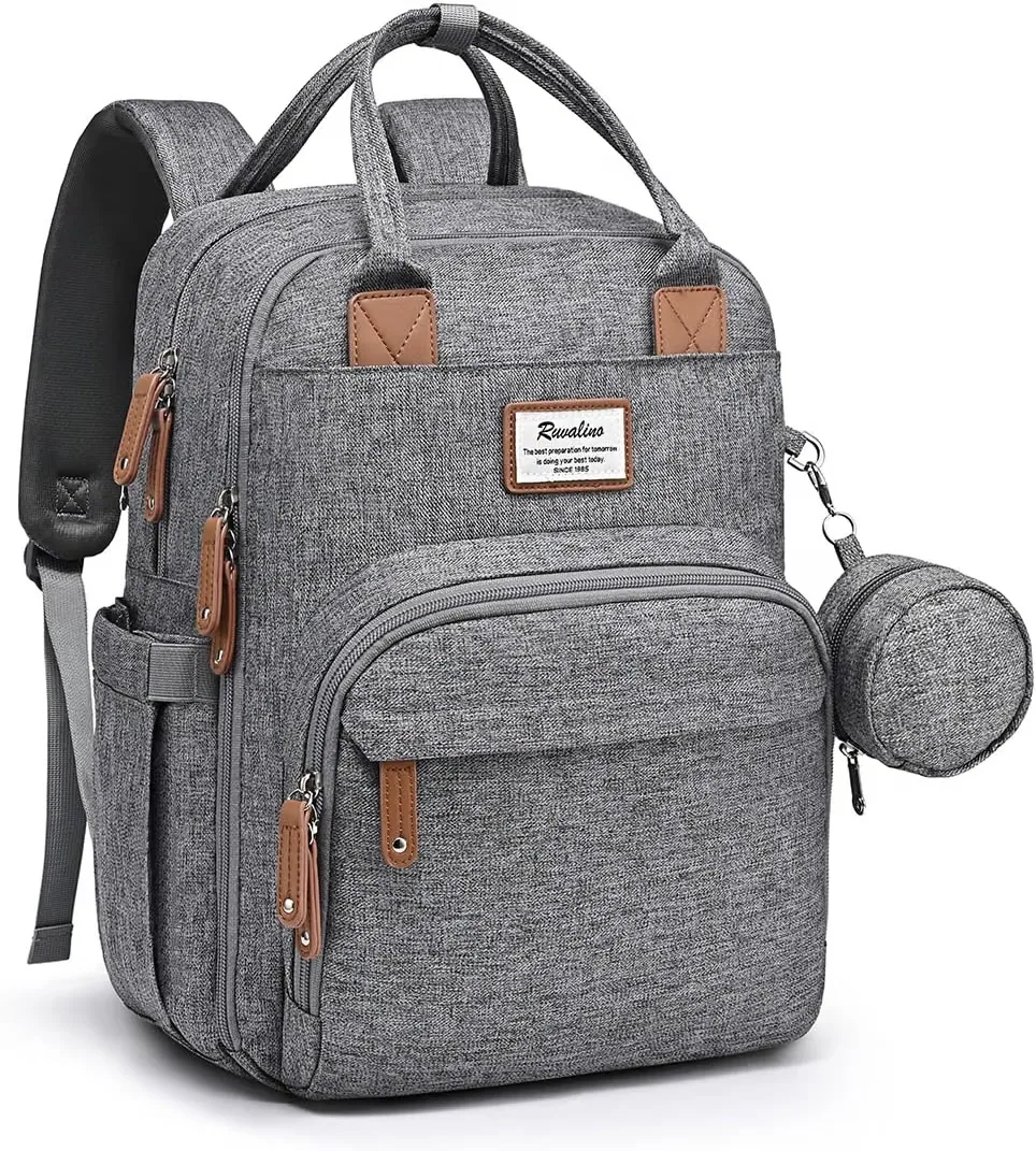 Ruvalino diaper bag backpack standing upright showing multi pocket storage compartments